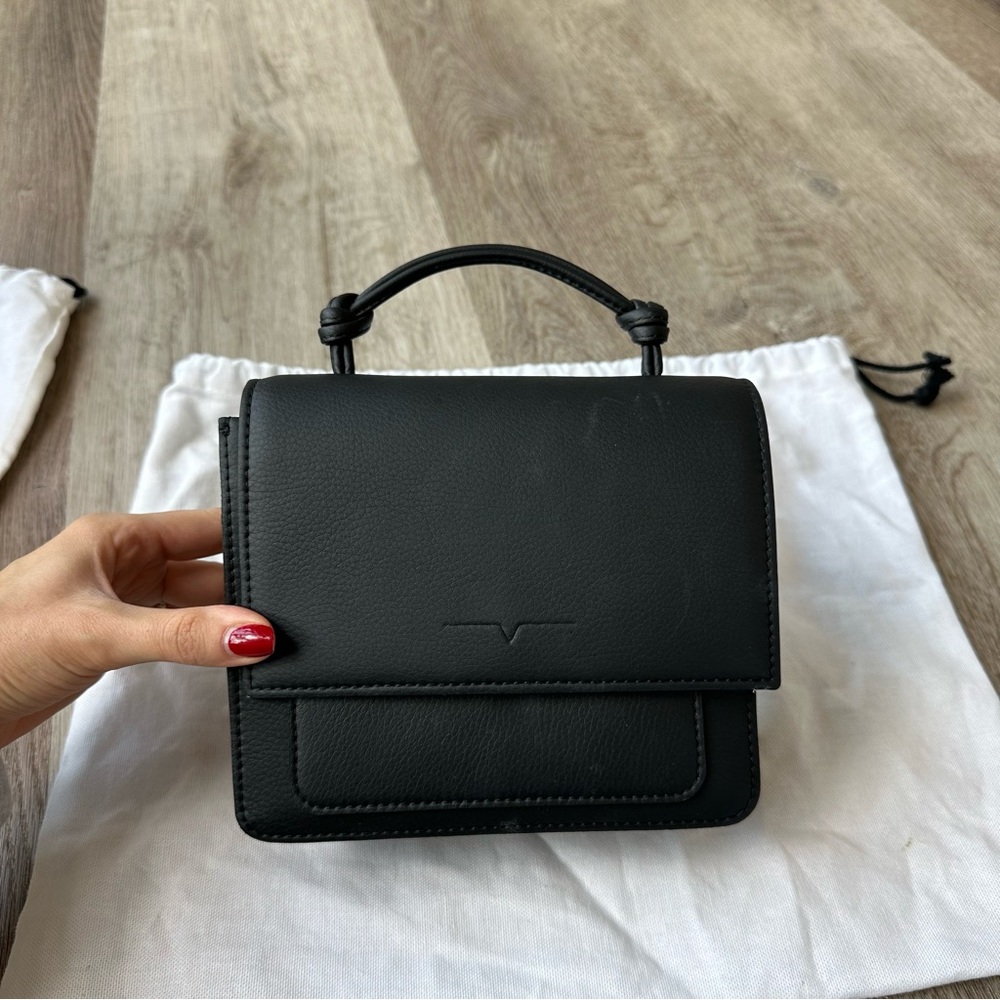 Von Holzhausen Mini Handheld Bag. Comes with crossbody strap and dust bag